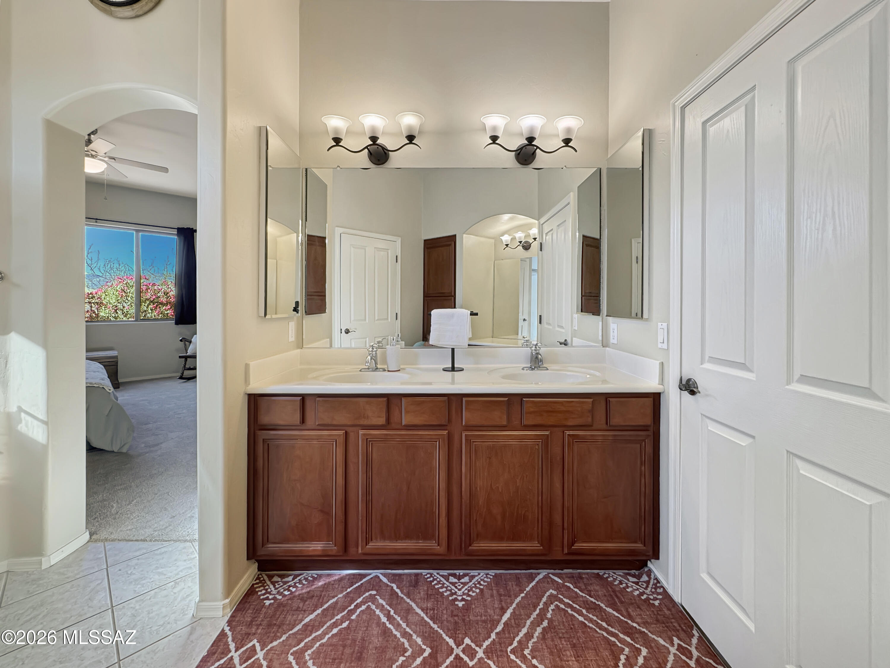 10835 South Heart Break Ridge Place Vail, AZ 85641 - Photo 26 of 49 a spacious bathroom with a double vanity sink a mirror and a shower