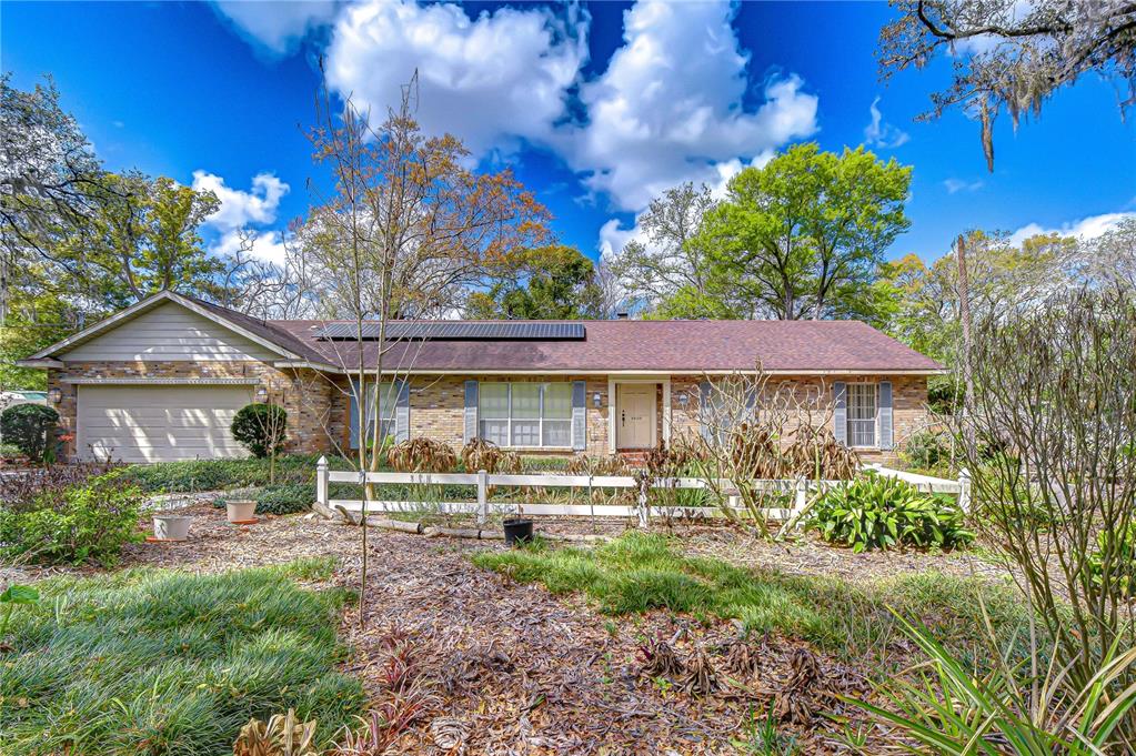 2608 Bellwood Drive Brandon, FL 33511 - Photo 1 of 27 a front view of a house with garden