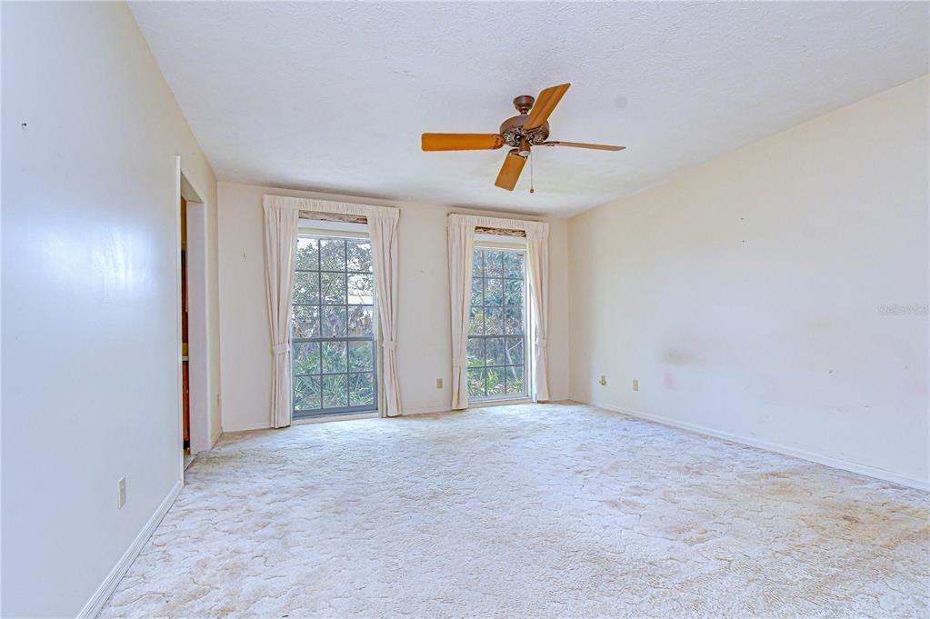 2608 Bellwood Drive Brandon, FL 33511 - Photo 13 of 27 a view of a livingroom with a ceiling fan and window