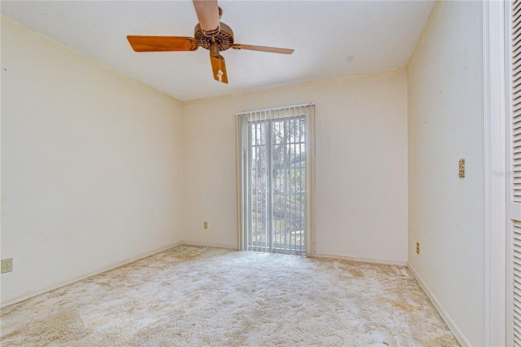 2608 Bellwood Drive Brandon, FL 33511 - Photo 17 of 27 an empty room with windows and fan