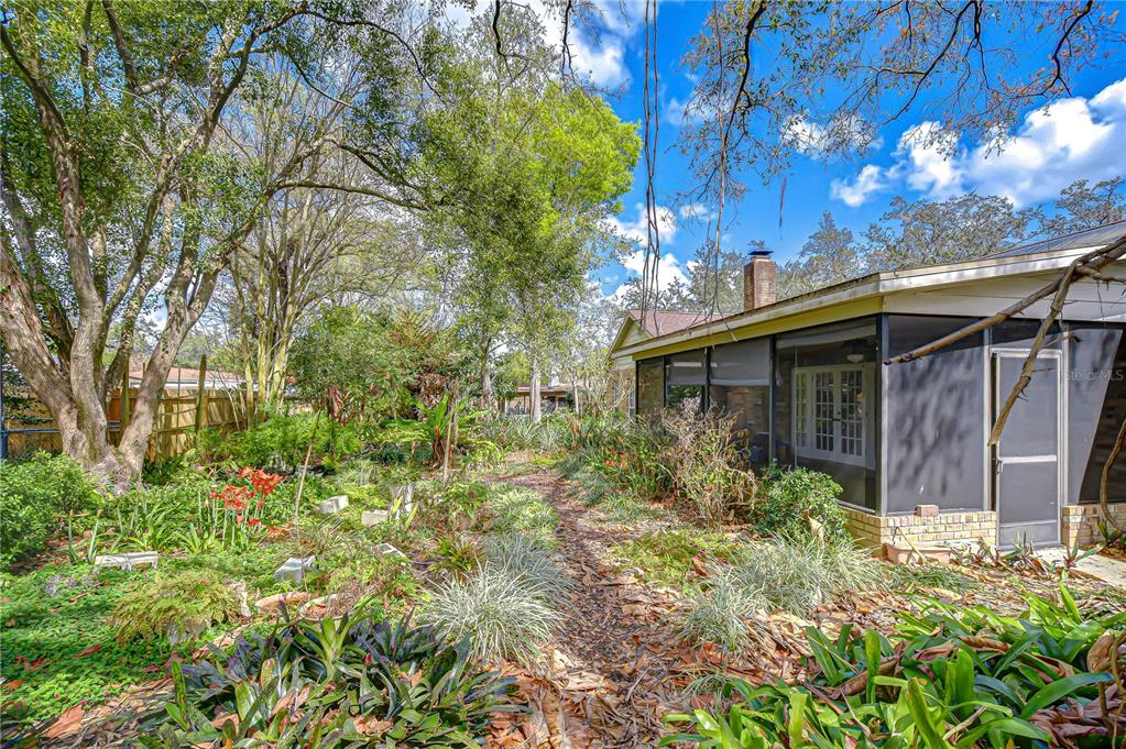 2608 Bellwood Drive Brandon, FL 33511 - Photo 23 of 27 a view of house with lot of plants