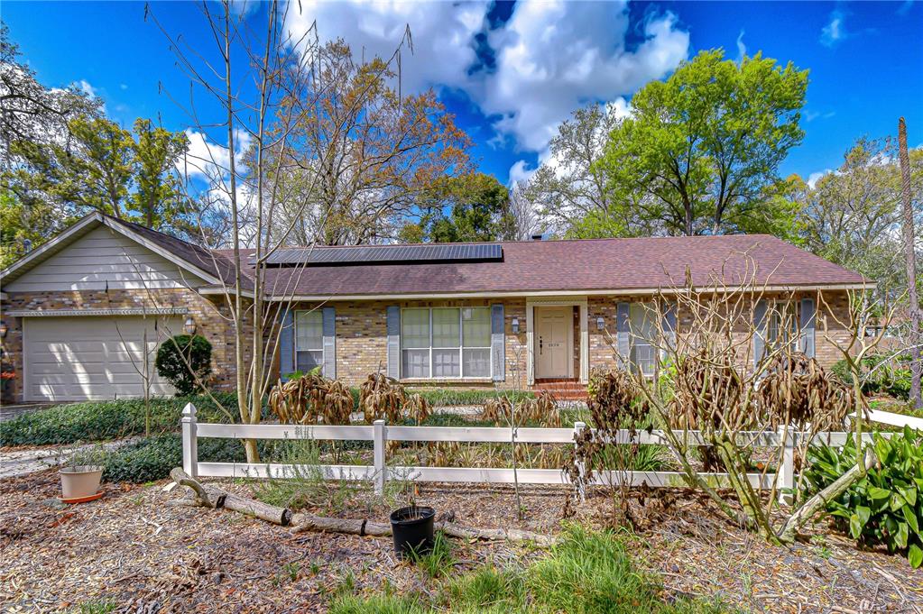 2608 Bellwood Drive Brandon, FL 33511 - Photo 26 of 27 a front view of a house with garden