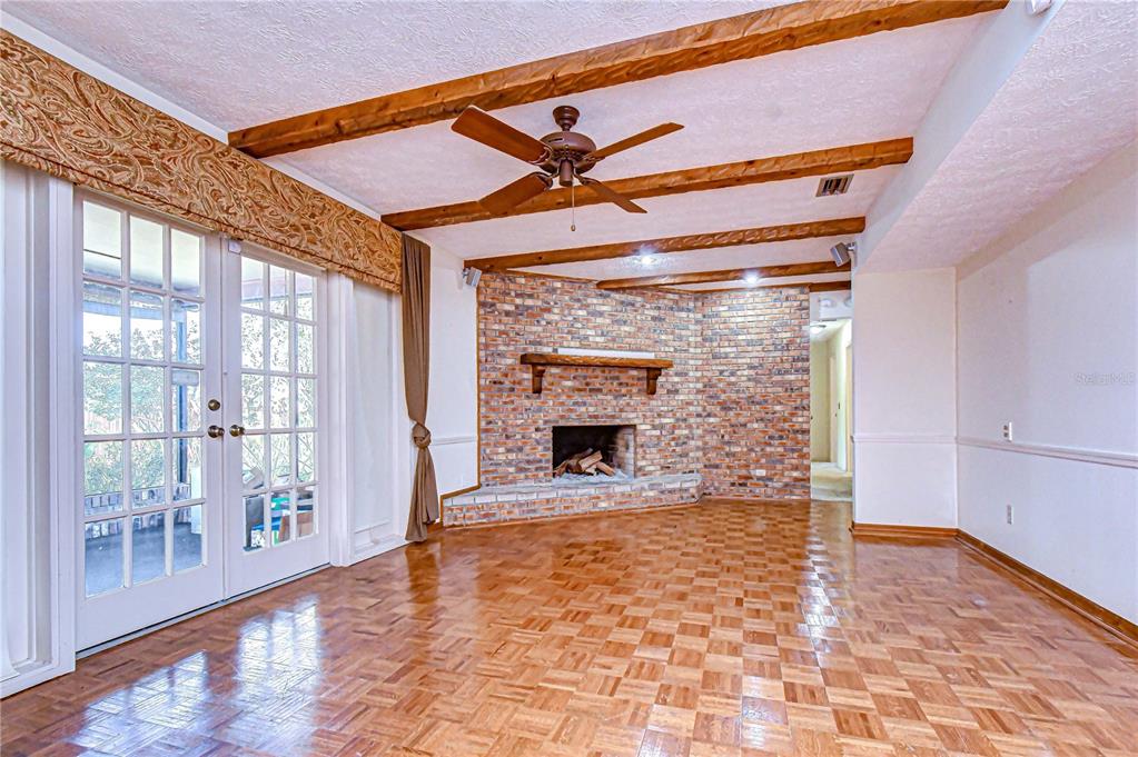 2608 Bellwood Drive Brandon, FL 33511 - Photo 3 of 27 a view of a hallway with a fireplace and a large window