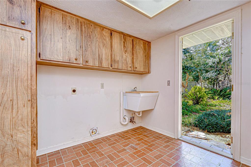 2608 Bellwood Drive Brandon, FL 33511 - Photo 10 of 27 a view of a room with wooden floor and cabinet