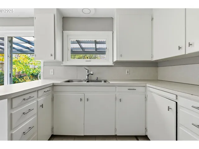 a kitchen with appliances cabinets and a counter top space