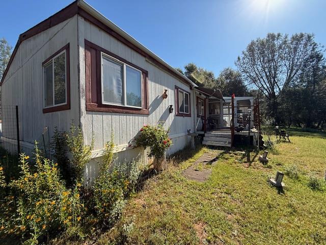 4565 Morgan Road Angels Camp, CA 95222 - Photo 10 of 43 view of home's exterior featuring a yard and a deck
