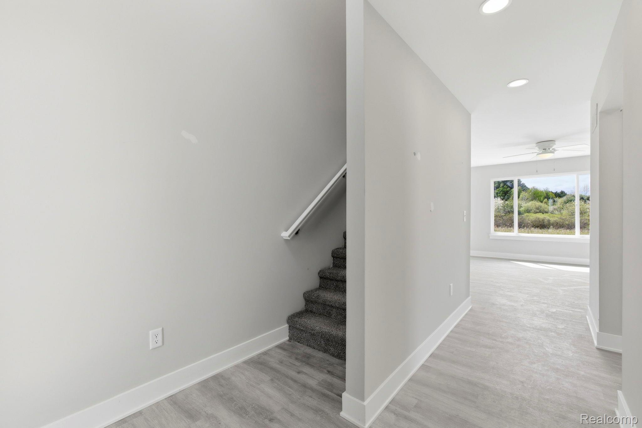 2361 Baltimore Davison, MI 48423 - Photo 4 of 31 Staircase with wood finished floors, a ceiling fan, and recessed lighting