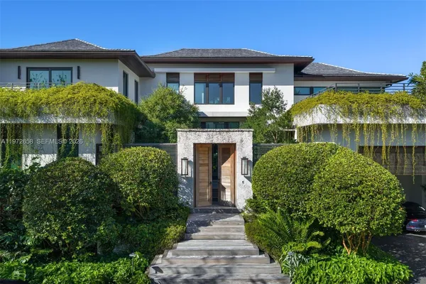 a front view of a house with garden