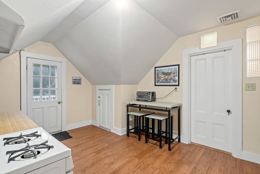 21 Wenham Street, Unit 3 Boston, MA 02130 - Photo 11 of 21 a view of a workspace with furniture and wooden floor