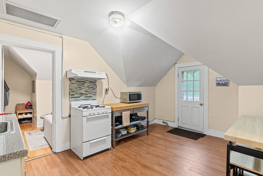21 Wenham Street, Unit 3 Boston, MA 02130 - Photo 12 of 21 a view of kitchen and kitchen with furniture wooden floor and window
