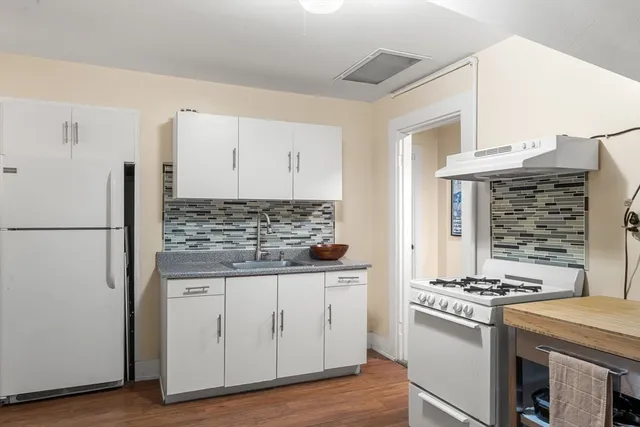 a kitchen with a stove and a refrigerator