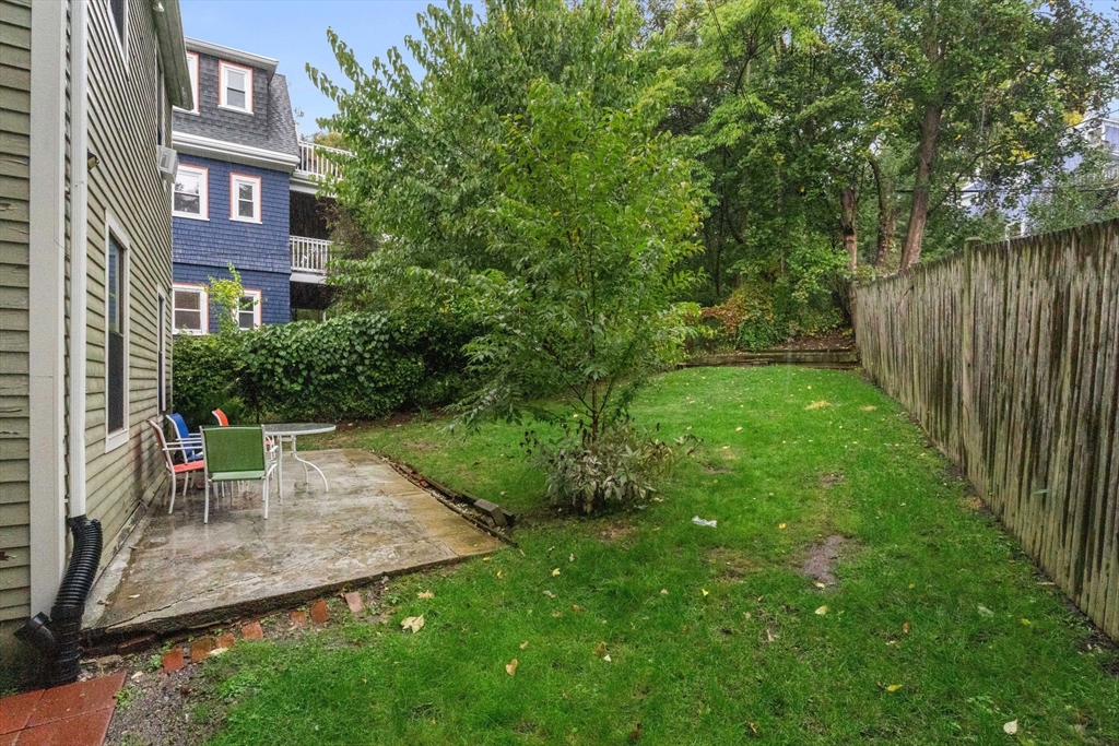 21 Wenham Street, Unit 3 Boston, MA 02130 - Photo 19 of 21 a view of a brick building next to a big yard