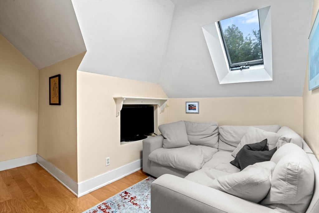 21 Wenham Street, Unit 3 Boston, MA 02130 - Photo 8 of 21 a living room with furniture and a fireplace