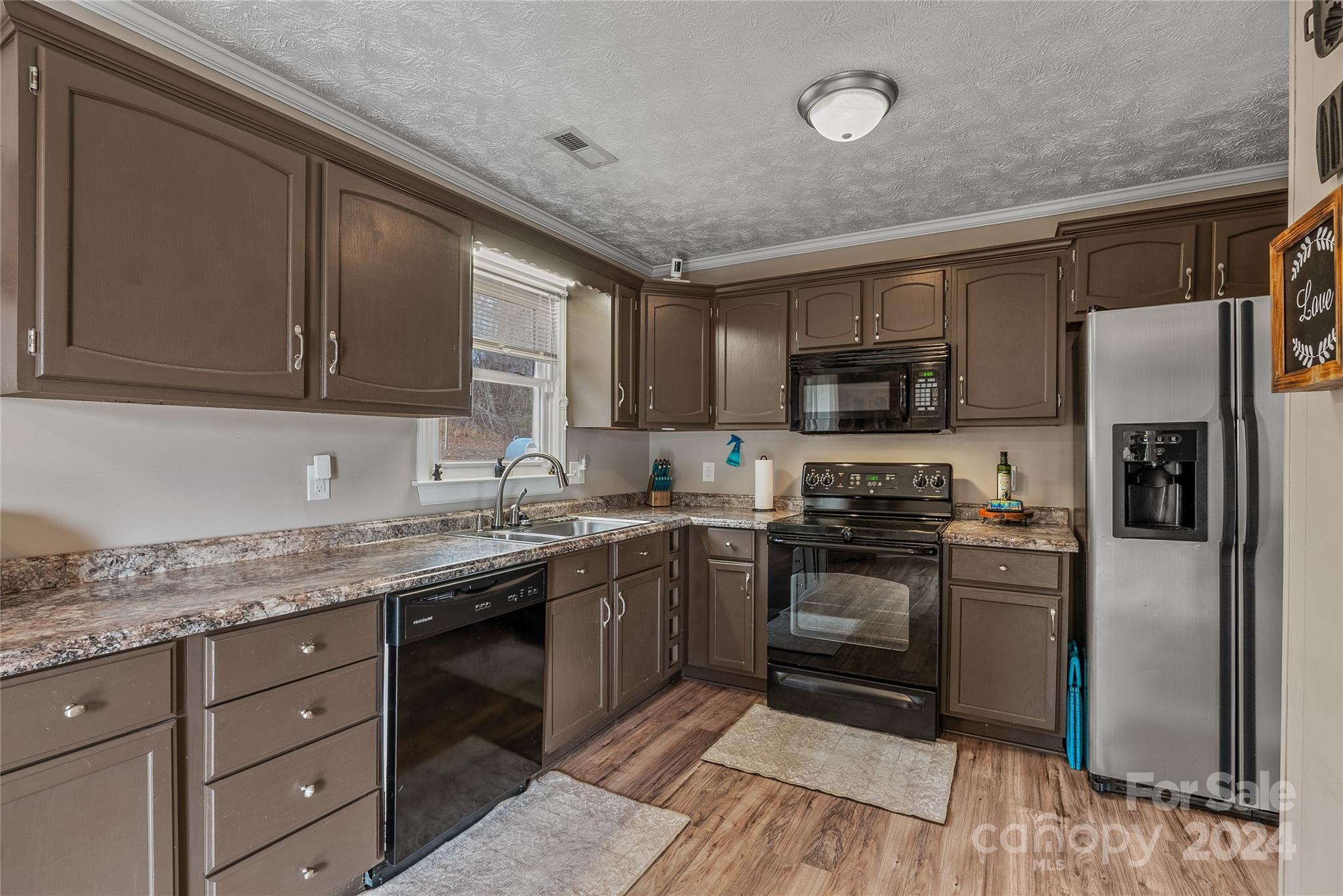 242 Maple Creek Road Rutherfordton, NC 28139 - Photo 14 of 37 a kitchen with stainless steel appliances granite countertop a stove top oven a sink dishwasher a refrigerator and a microwave oven
