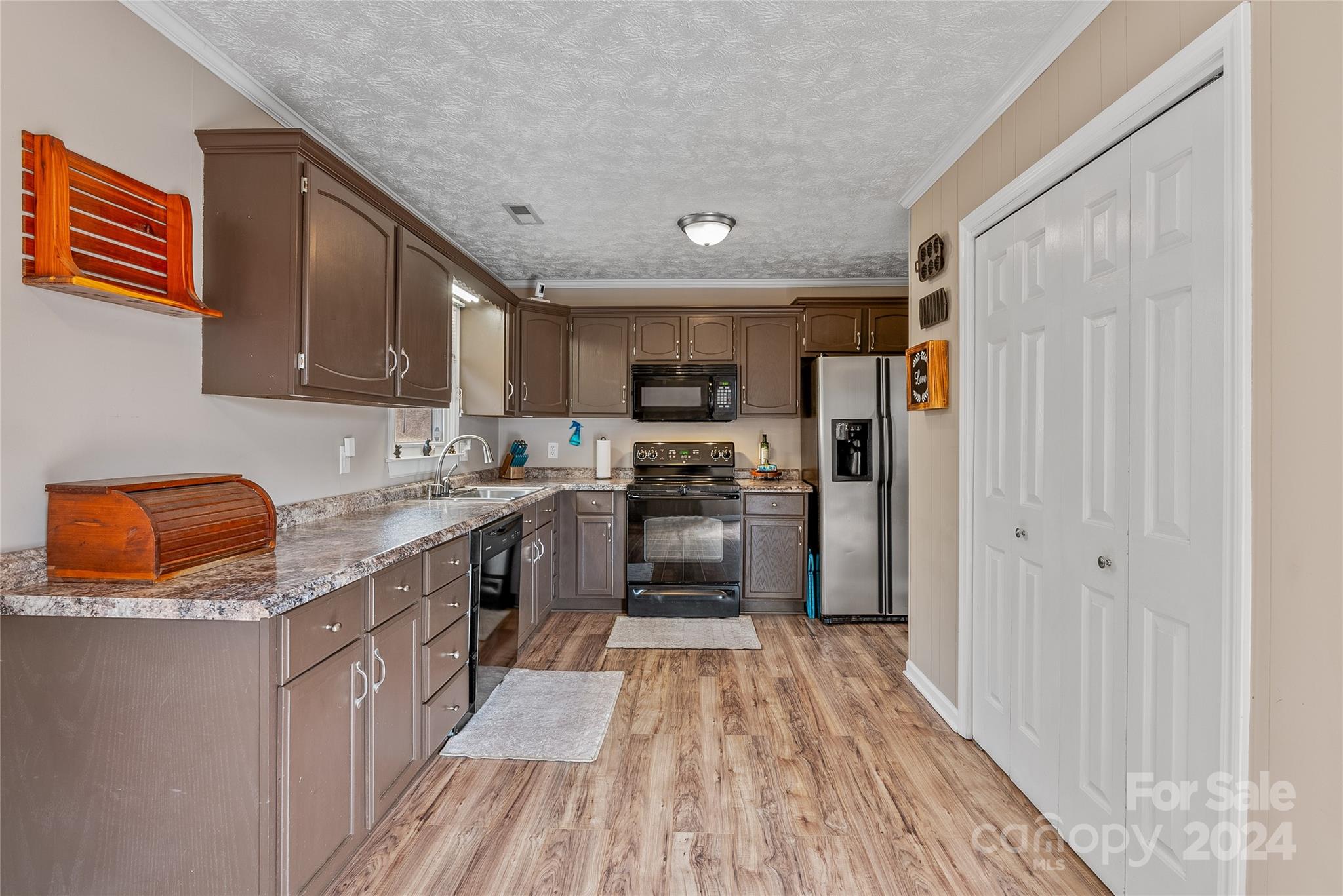 242 Maple Creek Road Rutherfordton, NC 28139 - Photo 24 of 37 a kitchen with stainless steel appliances granite countertop a refrigerator a stove top oven a sink and dishwasher