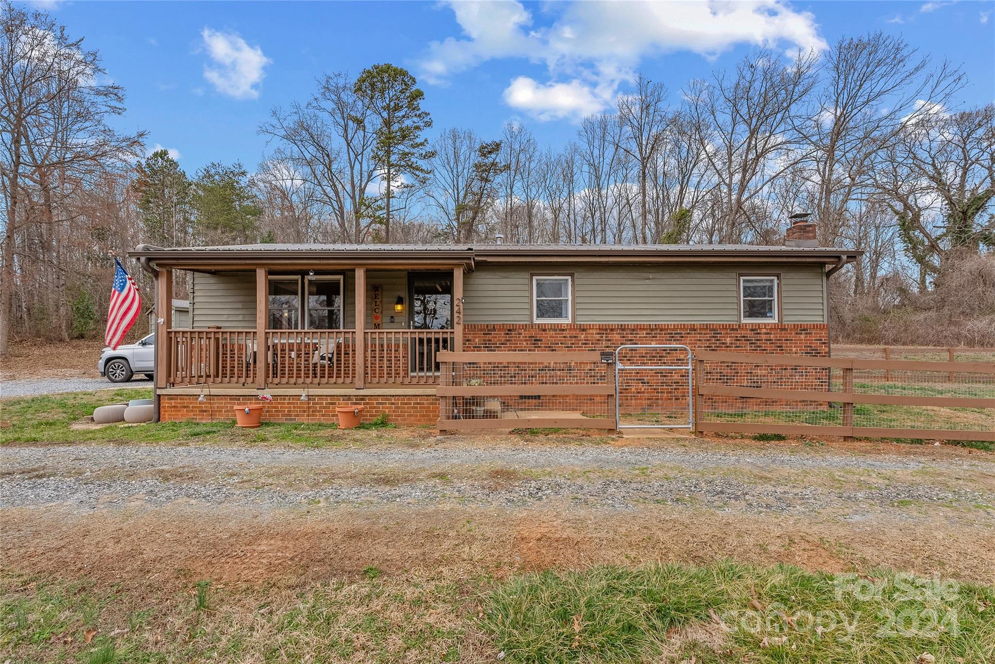242 Maple Creek Road Rutherfordton, NC 28139 - Photo 32 of 37 a view of house with backyard and trees in the background