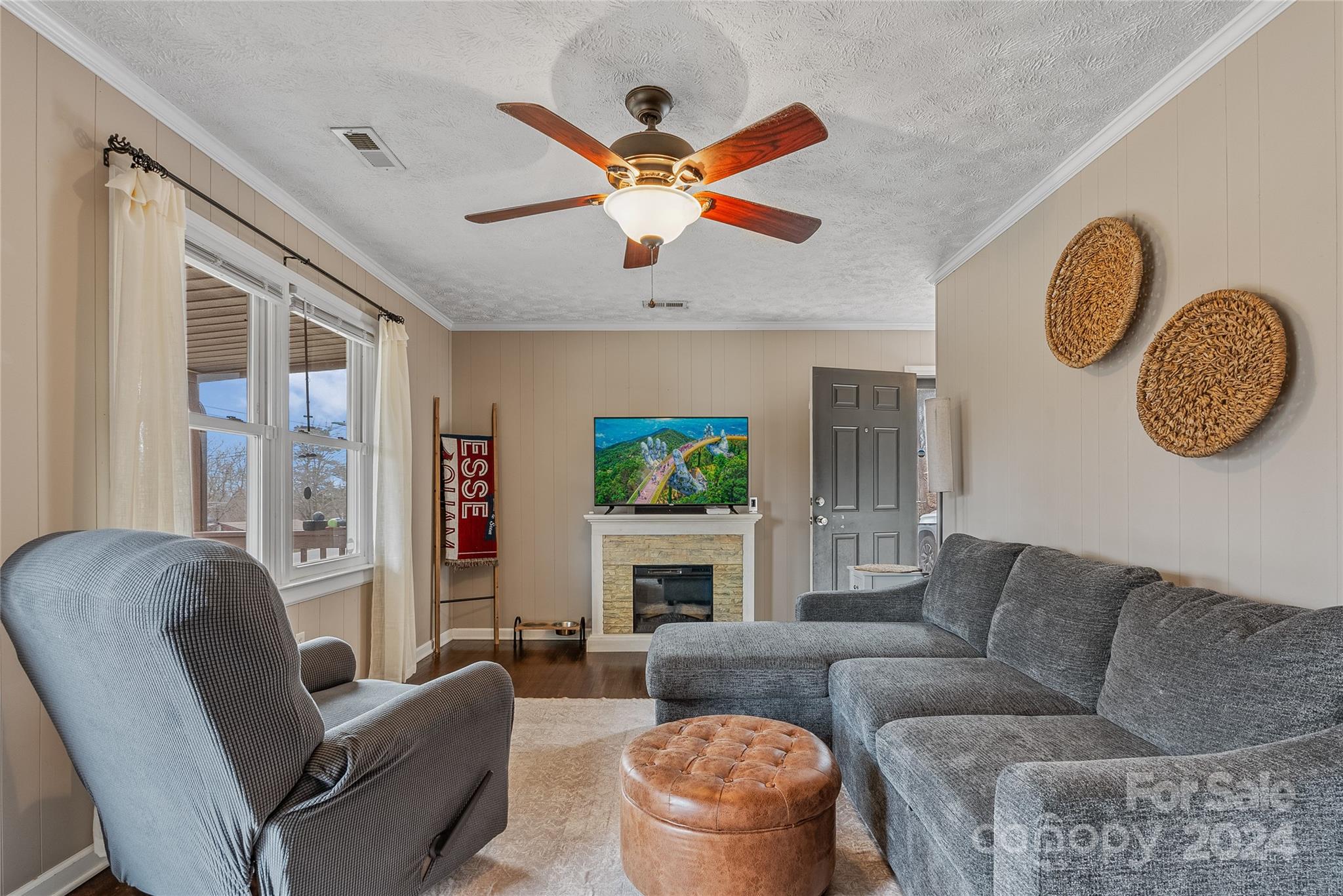 242 Maple Creek Road Rutherfordton, NC 28139 - Photo 6 of 37 a living room with furniture a fireplace and a large window