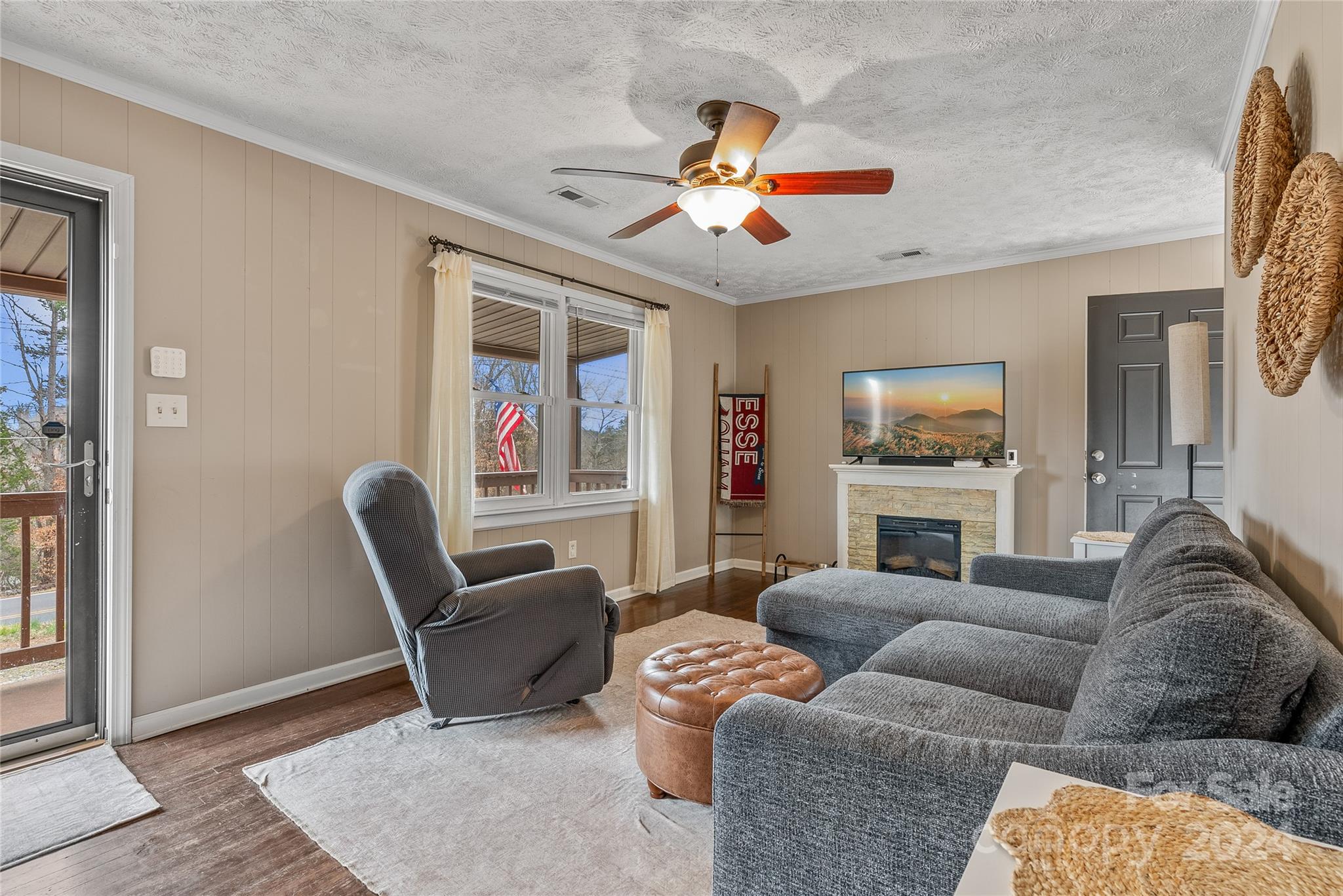 242 Maple Creek Road Rutherfordton, NC 28139 - Photo 7 of 37 a living room with furniture a ceiling fan and a flat screen tv