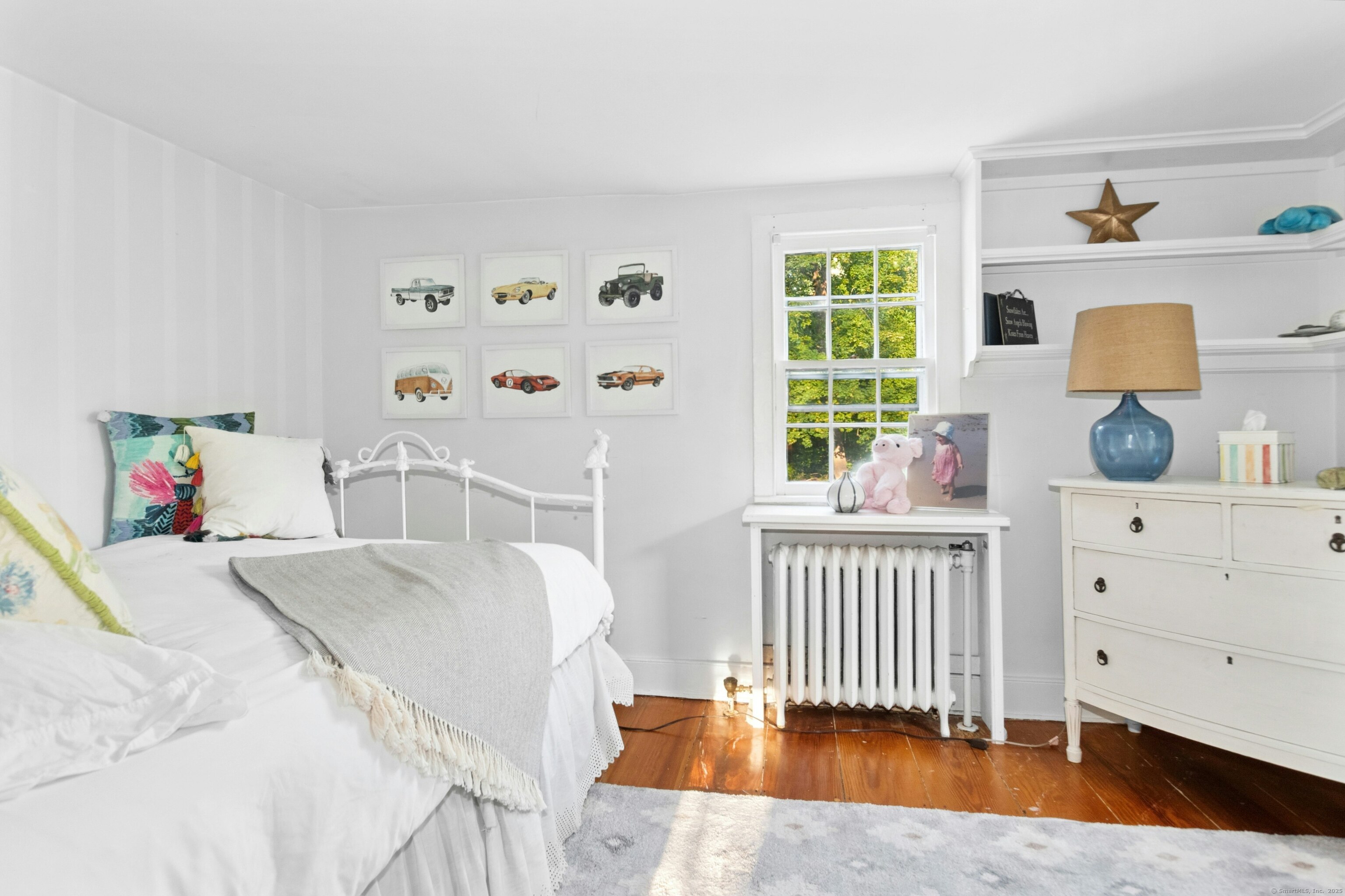 561 Middlesex Road Darien, CT 06820 - Photo 24 of 34 a bedroom with a bed and a window