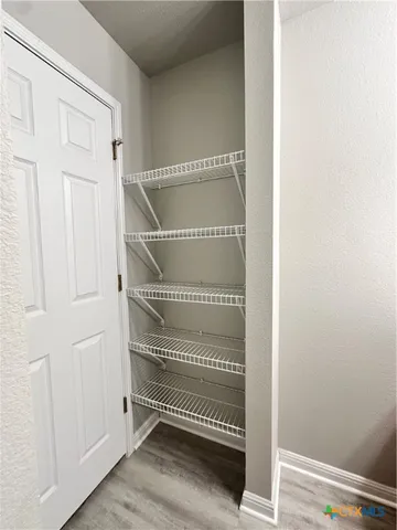a view of entryway with wooden floor