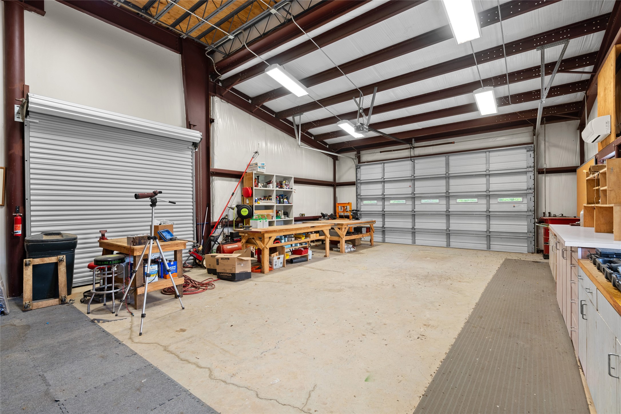 15126 Walden Road Montgomery, TX 77356 - Photo 28 of 50 Secluded workroom featuring individual roll up doors, ideal for specialty crafts and mechanical work.