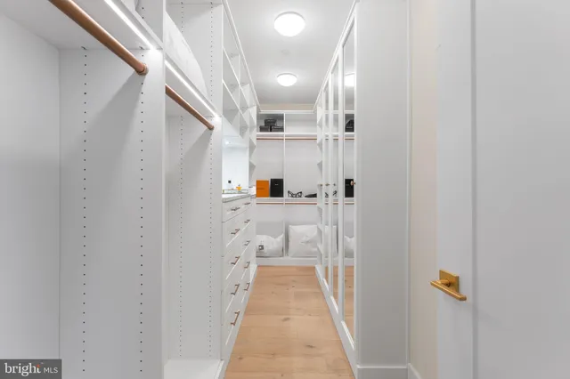 a bedroom with a bed and a lamp