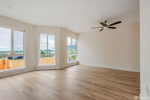 a kitchen with stainless steel appliances granite countertop a refrigerator a stove a sink dishwasher and a refrigerator