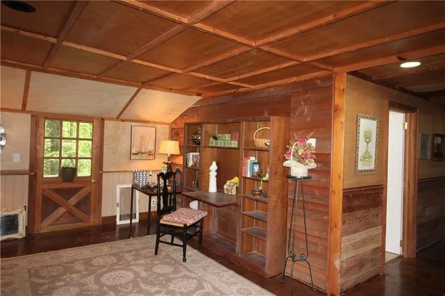 a view of a livingroom with furniture and a window