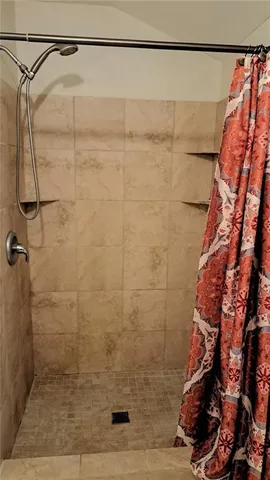 a room with lots of furniture and a large window