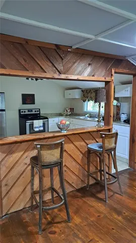 a room with furniture and a wooden floor