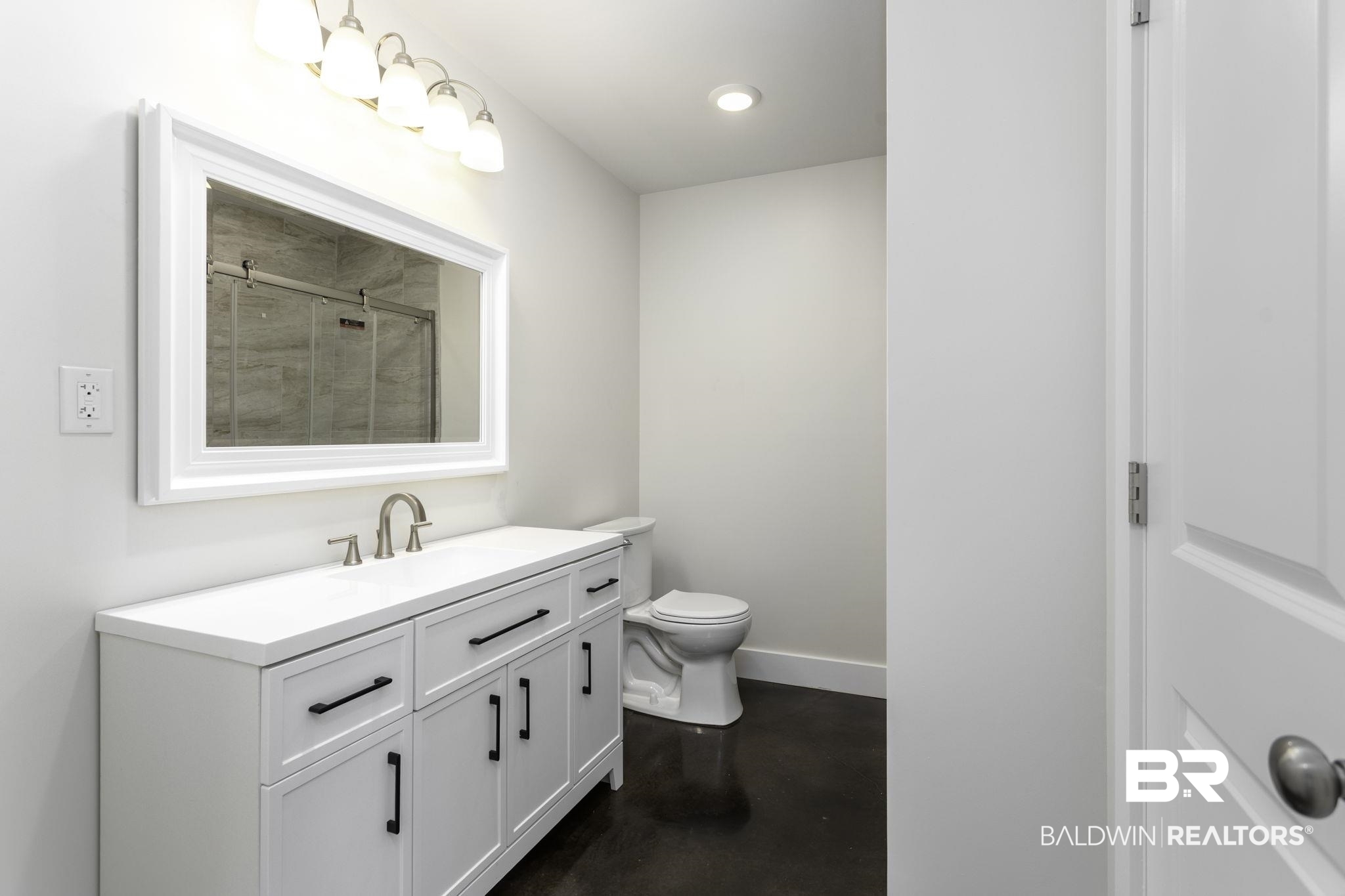 17126 Sugar Loop Foley, AL 36535 - Photo 16 of 28 Bathroom featuring tiled shower, concrete floors, vanity, and recessed lighting