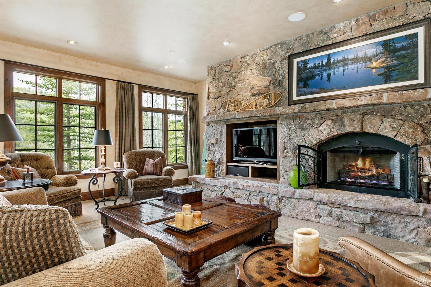 2156 Cresta Road Edwards, CO 81632 - Photo 11 of 25 a living room with furniture and a fireplace