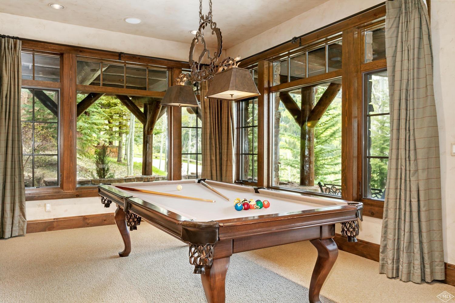 2156 Cresta Road Edwards, CO 81632 - Photo 12 of 25 a room with chandelier furniture and windows