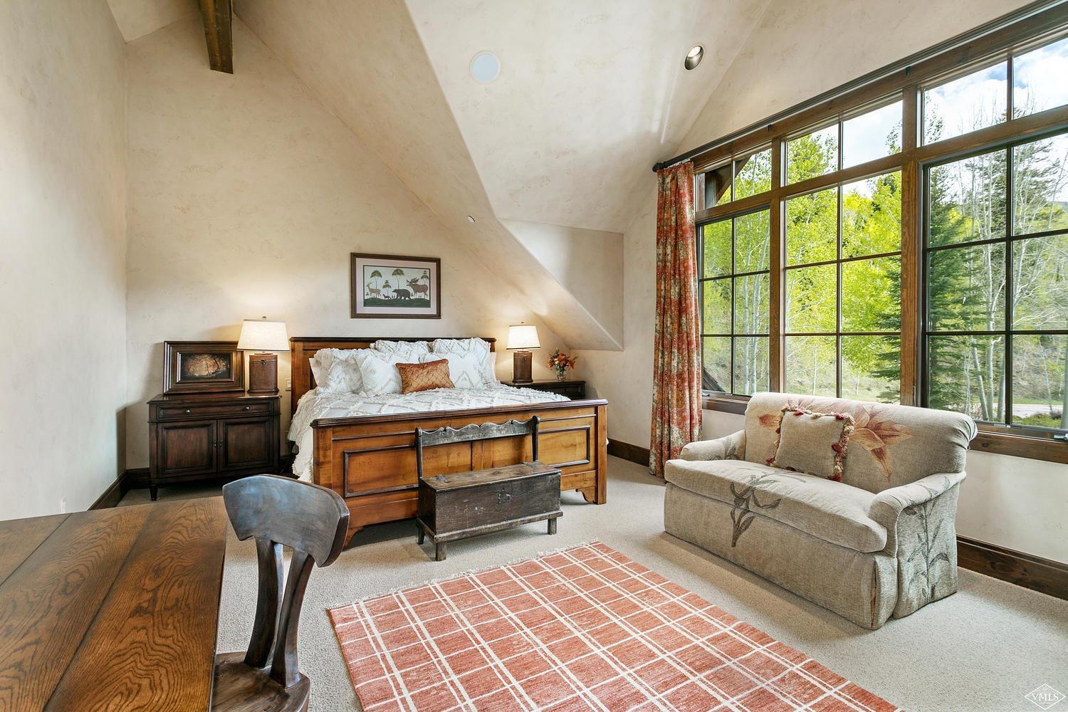 2156 Cresta Road Edwards, CO 81632 - Photo 20 of 25 a bedroom with furniture and a large window