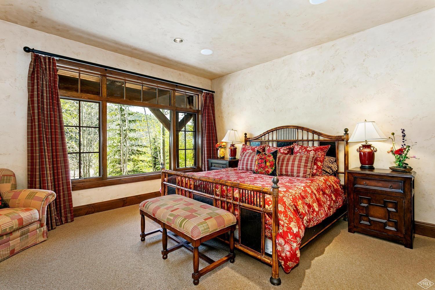 2156 Cresta Road Edwards, CO 81632 - Photo 22 of 25 a bedroom with a bed chair and a window