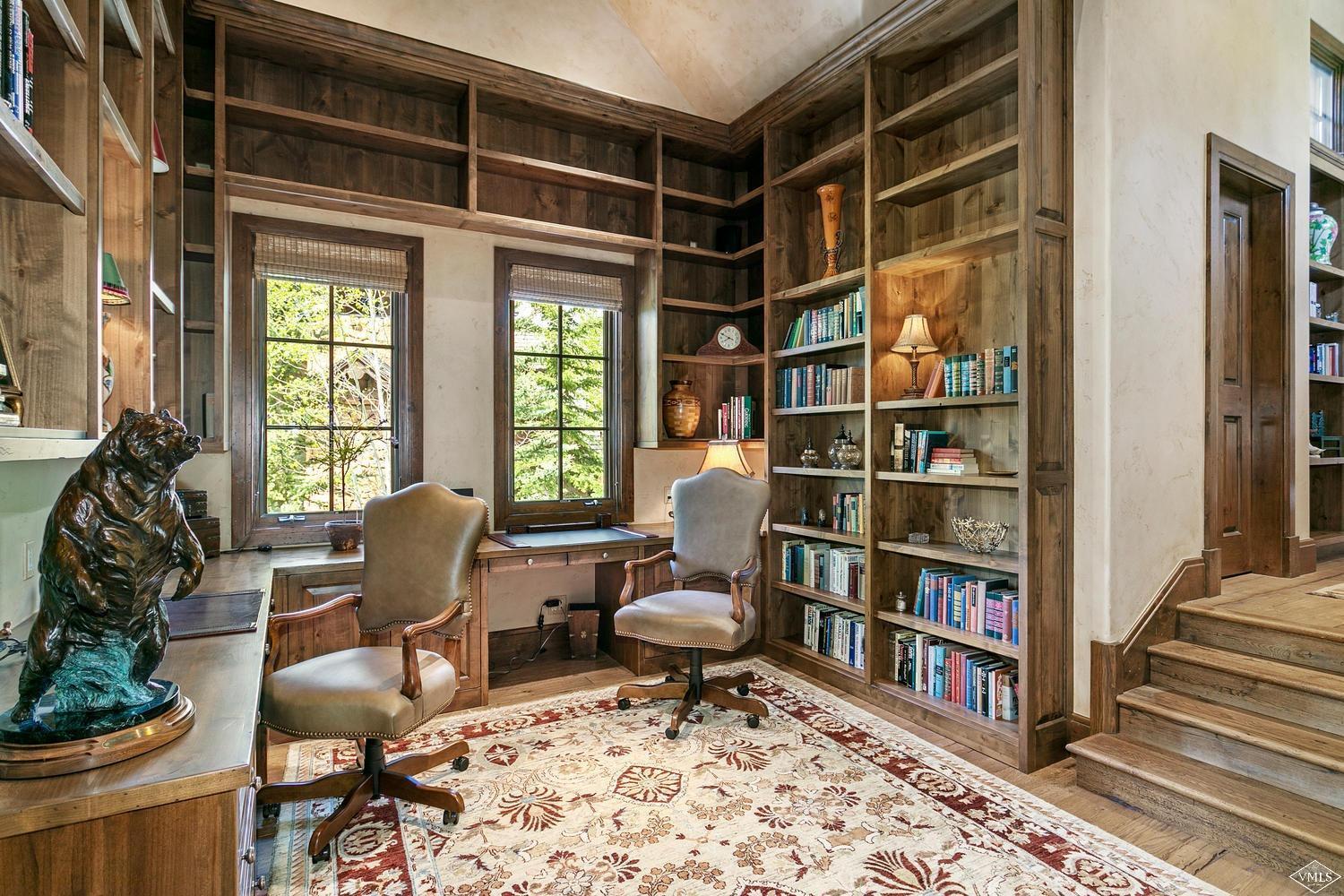 2156 Cresta Road Edwards, CO 81632 - Photo 25 of 25 a living room with furniture and a book shelf