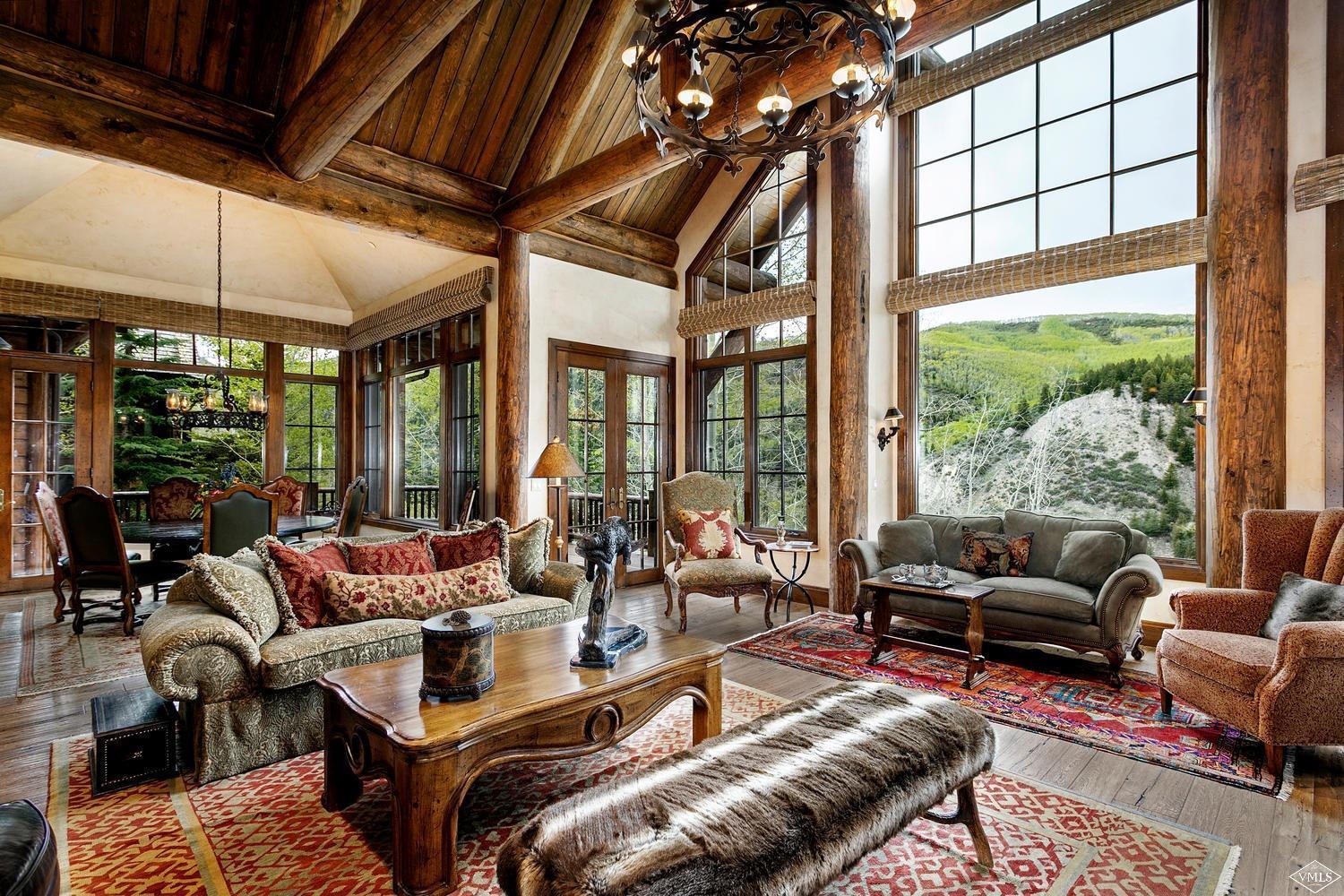 2156 Cresta Road Edwards, CO 81632 - Photo 7 of 25 a living room with furniture and floor to ceiling windows