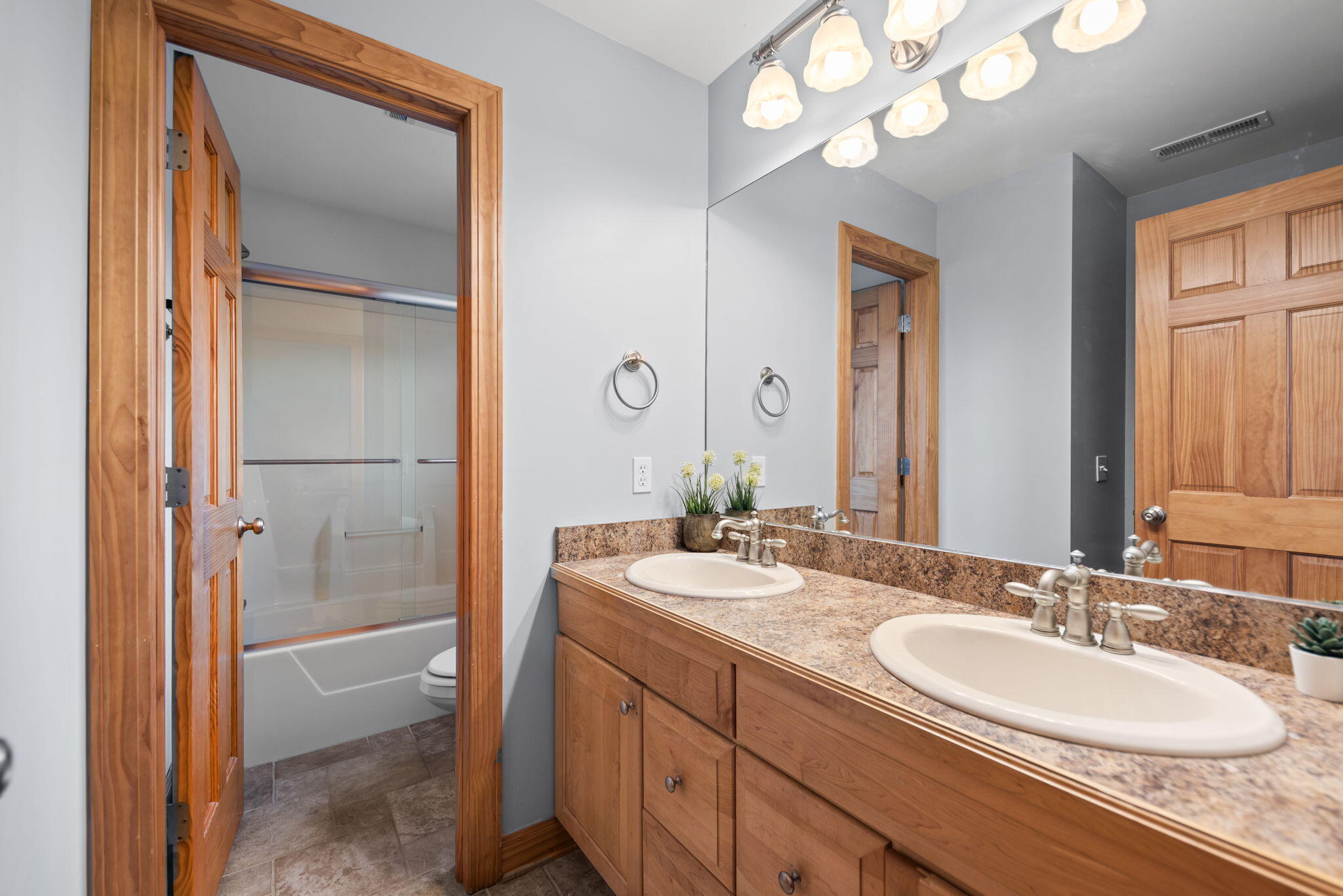3102 Coachman Trail Valparaiso, IN 46385 - Photo 22 of 33 a bathroom with a granite countertop sink double vanity and a mirror
