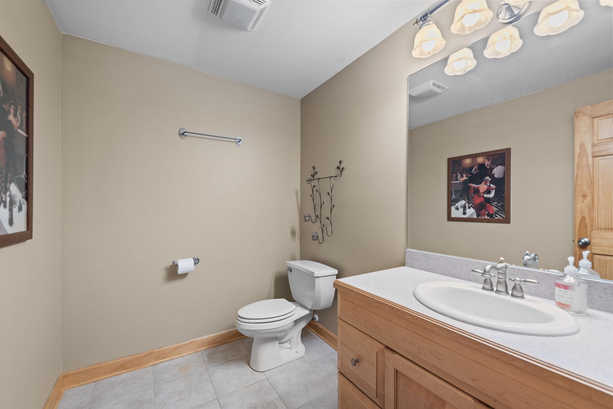 3102 Coachman Trail Valparaiso, IN 46385 - Photo 29 of 33 a bathroom with a toilet sink vanity and mirror