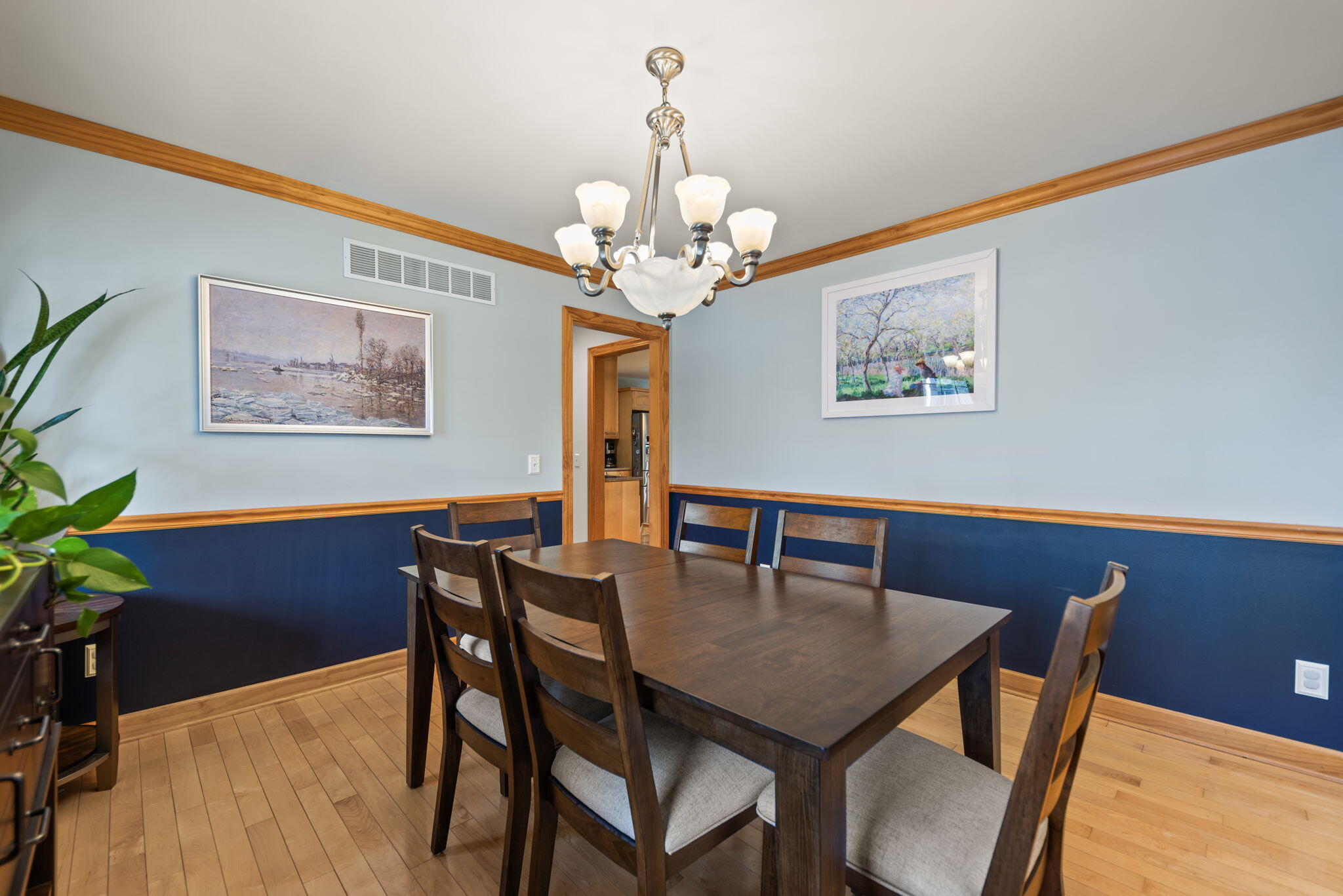3102 Coachman Trail Valparaiso, IN 46385 - Photo 6 of 33 a view of a dining room with furniture wooden floor and a chandelier