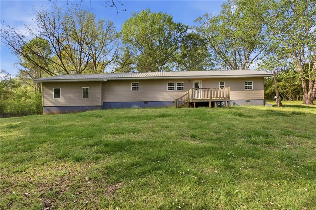 6668 Belton Bridge Road Lula, GA 30554 - Photo 27 of 29 a view of a house with a yard