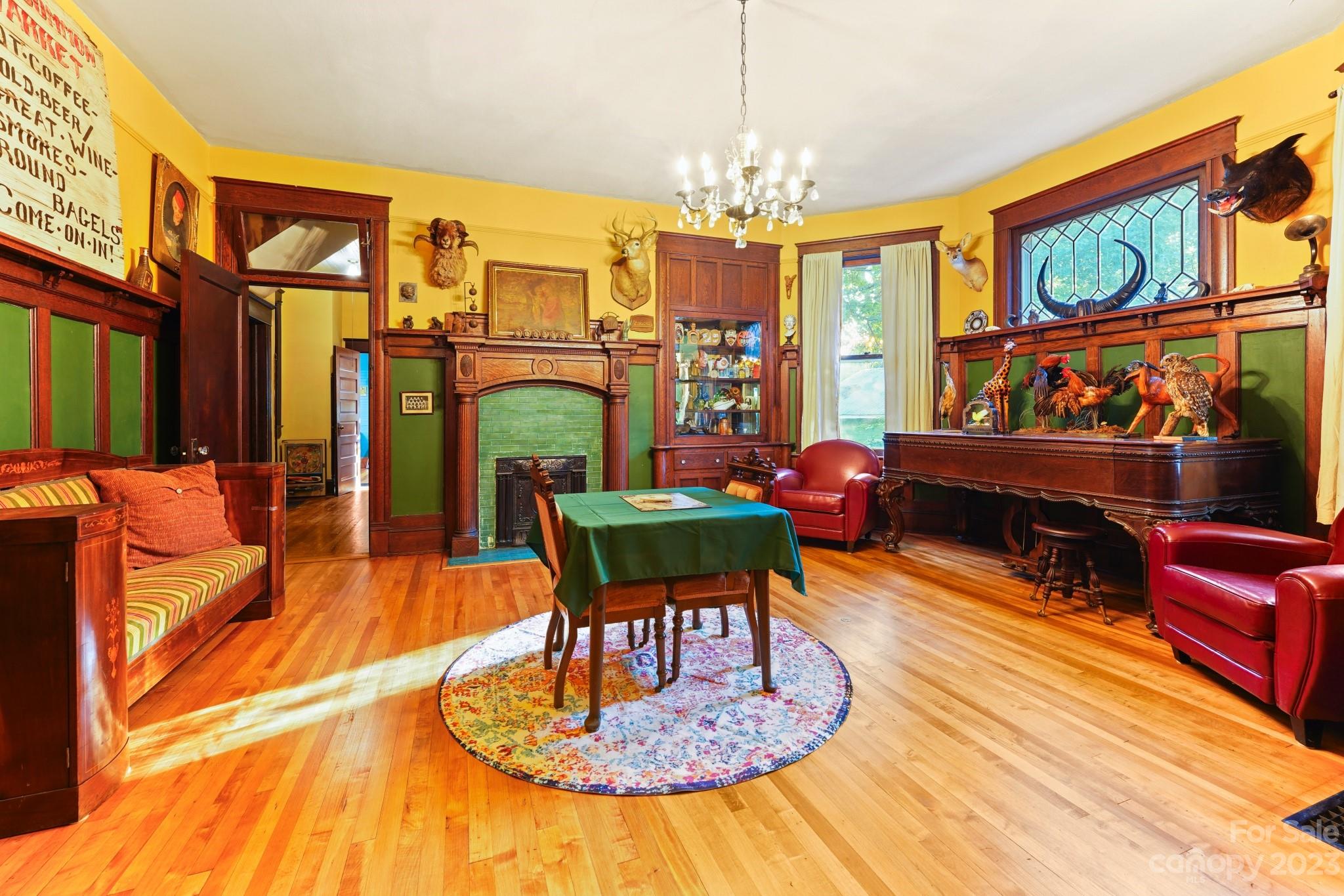 810 East Franklin Street Monroe, NC 28112 - Photo 12 of 47 a living room with fireplace furniture and a chandelier