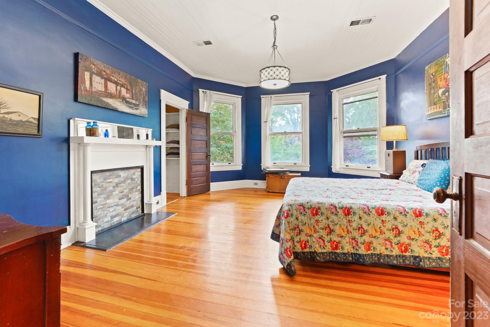 810 East Franklin Street Monroe, NC 28112 - Photo 18 of 47 a bedroom with a large bed and a large window