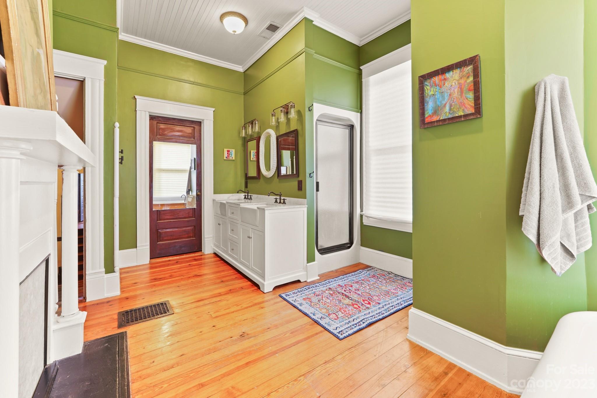 810 East Franklin Street Monroe, NC 28112 - Photo 20 of 47 a spacious bedroom with a bed and a dresser
