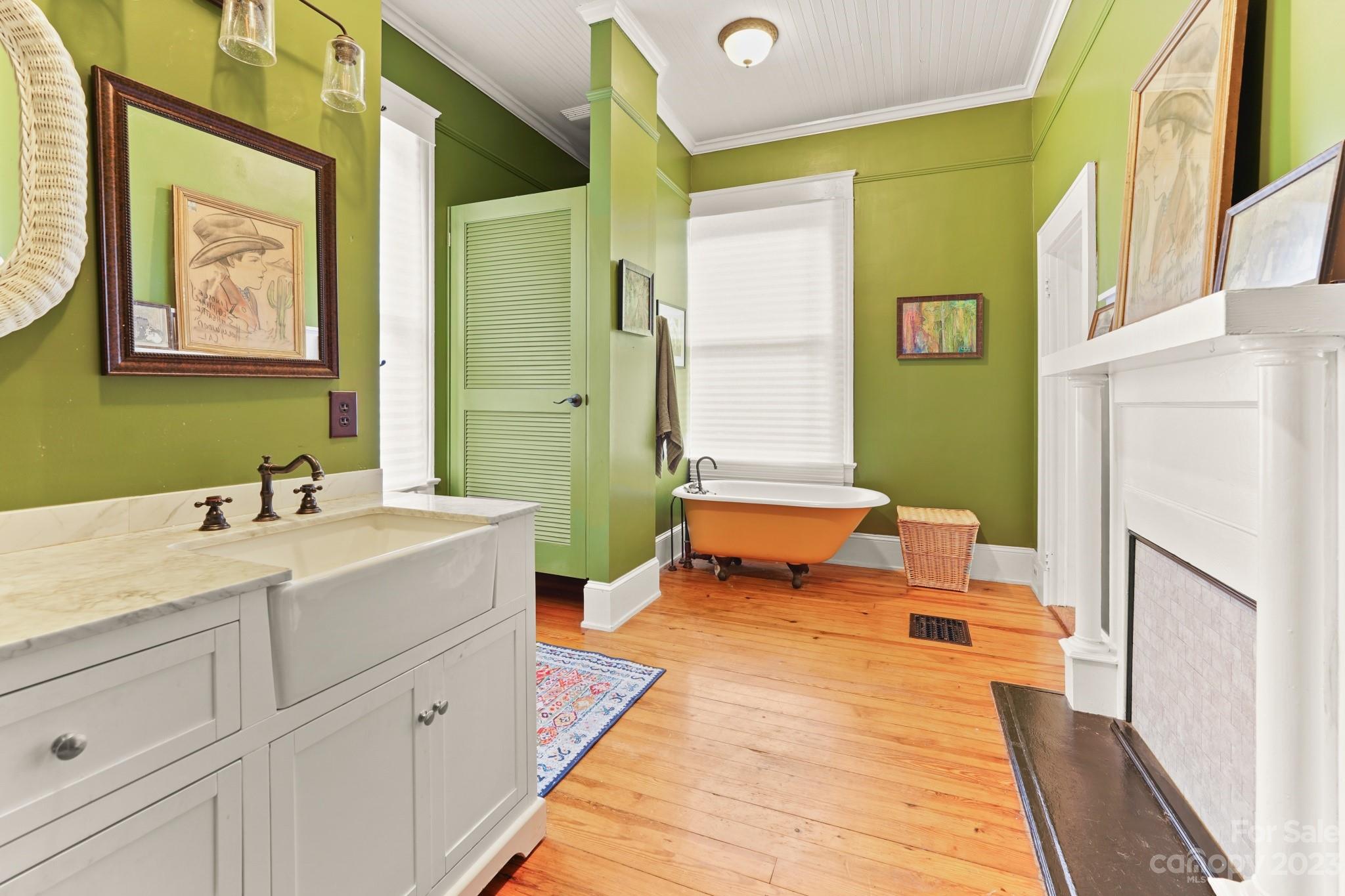 810 East Franklin Street Monroe, NC 28112 - Photo 21 of 47 a spacious bathroom with a double vanity sink and a mirror