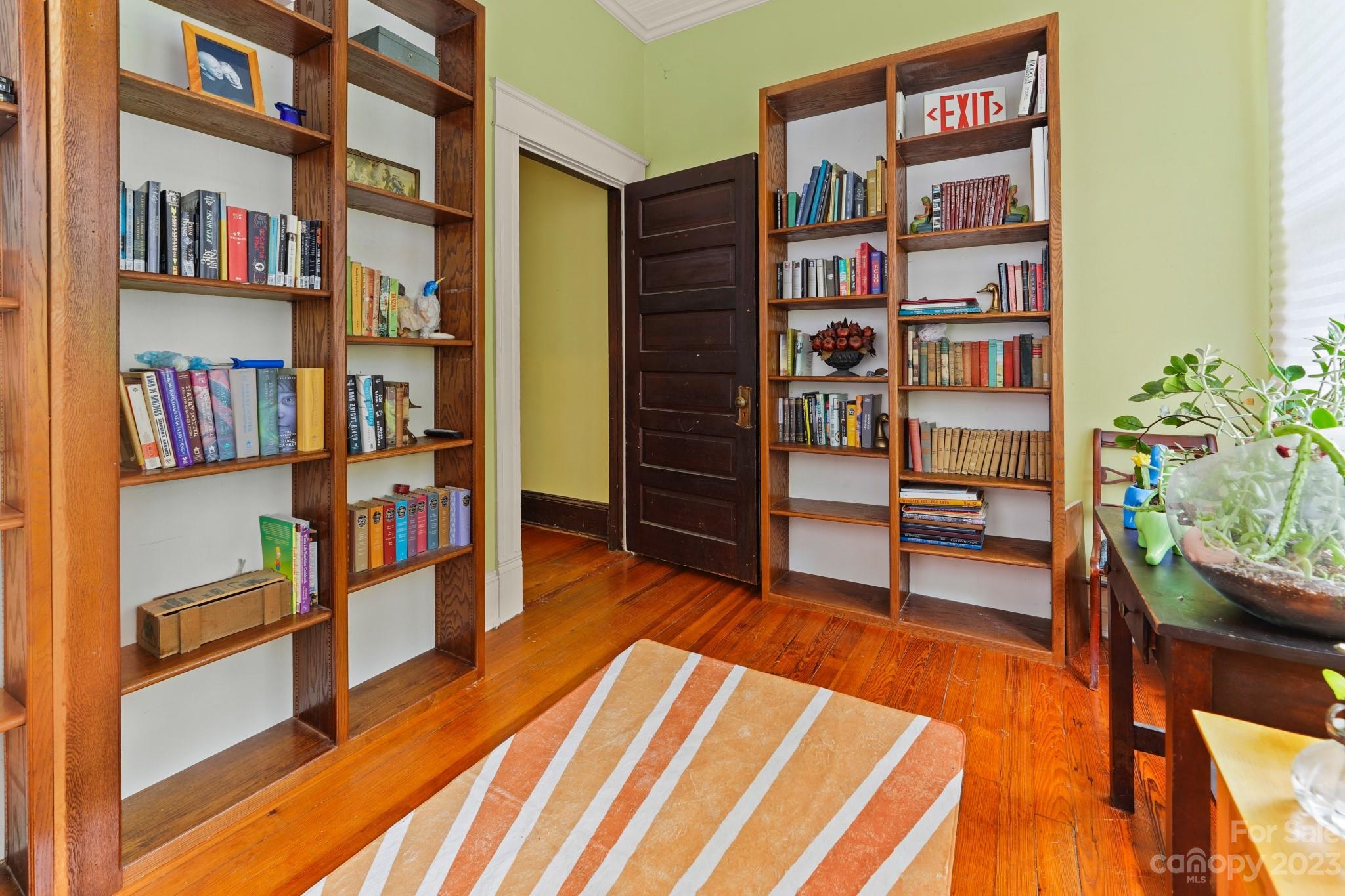 810 East Franklin Street Monroe, NC 28112 - Photo 30 of 47 a living room with furniture and a book shelf
