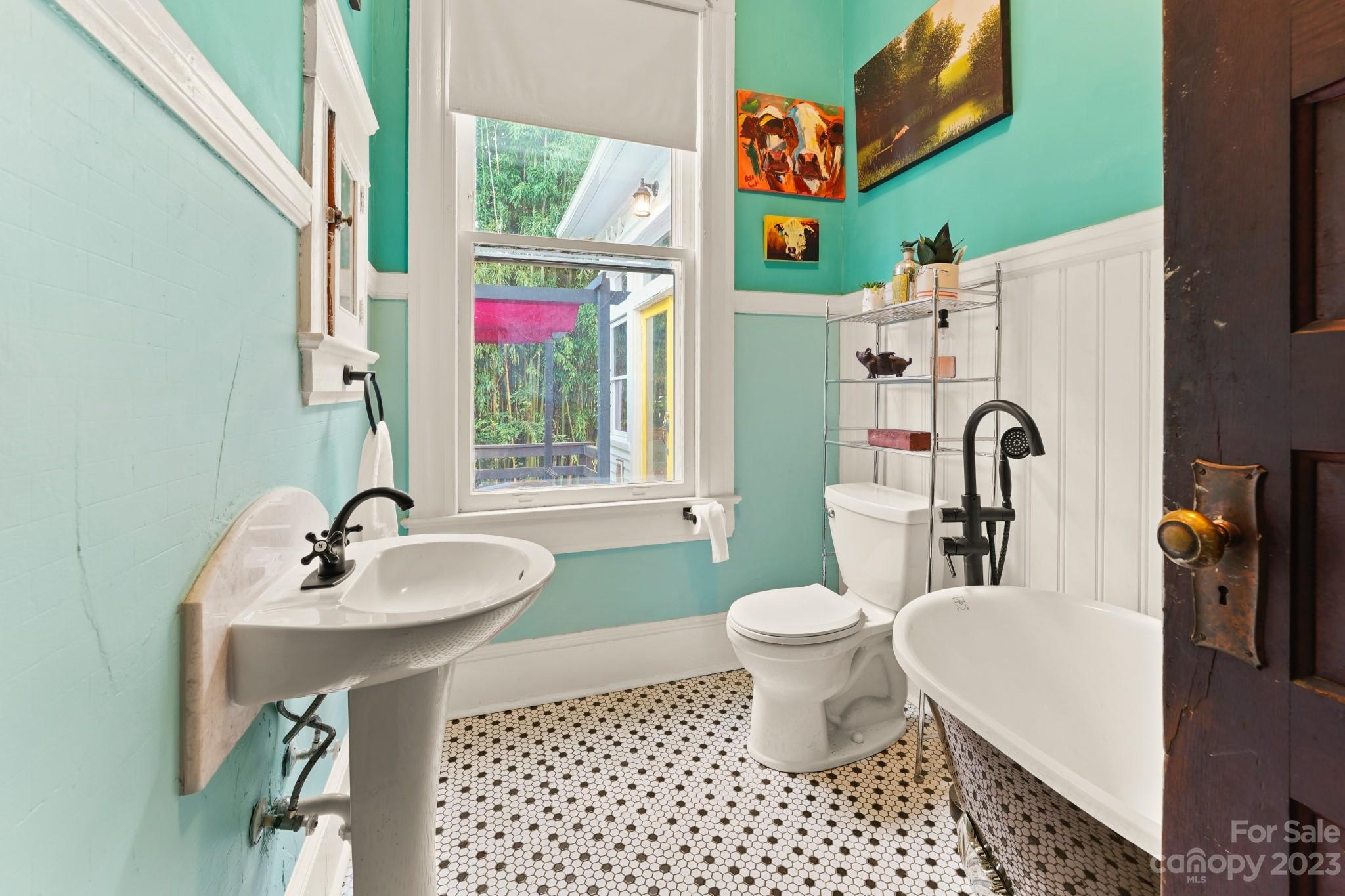 810 East Franklin Street Monroe, NC 28112 - Photo 34 of 47 a bathroom with a sink and a mirror