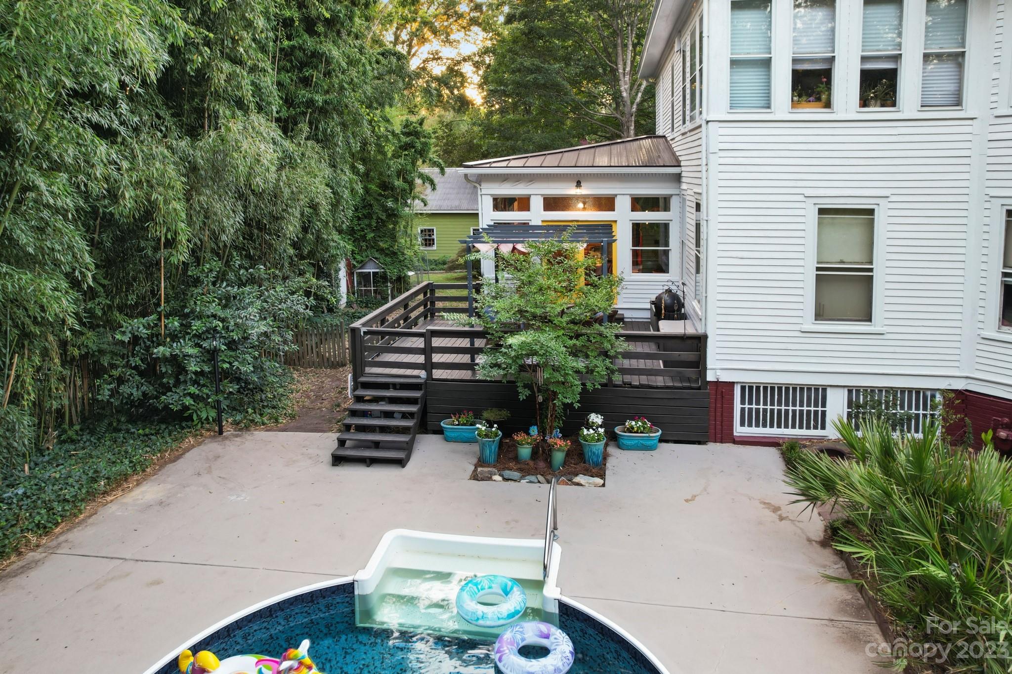 810 East Franklin Street Monroe, NC 28112 - Photo 37 of 47 a view of a chairs and table in the back yard of the house