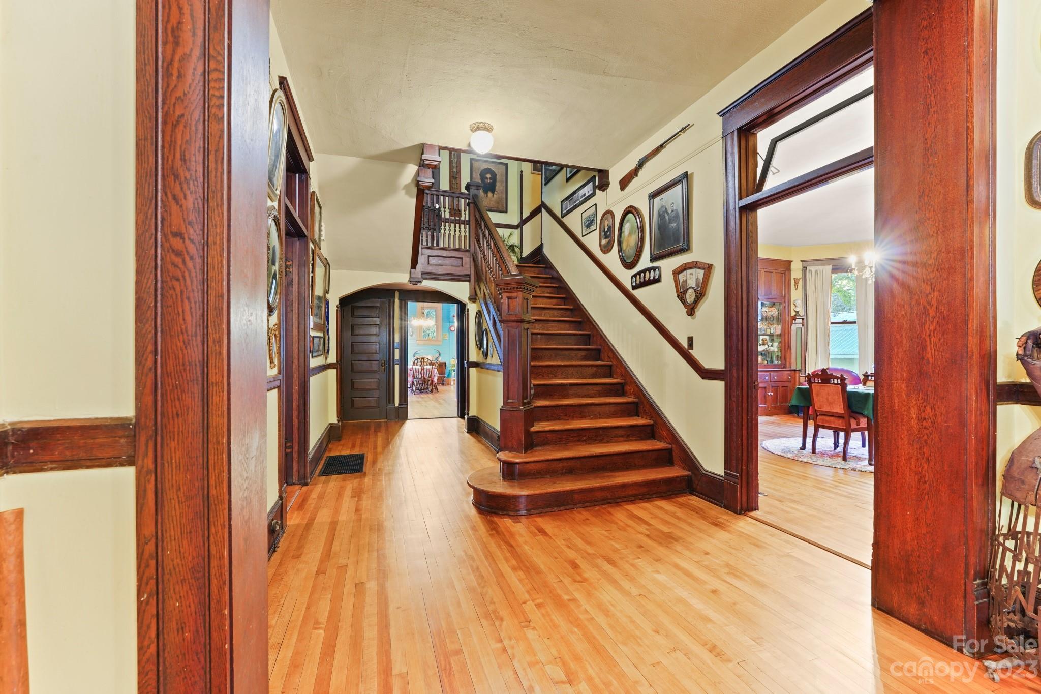 810 East Franklin Street Monroe, NC 28112 - Photo 4 of 47 a view of entryway and hall with wooden floor