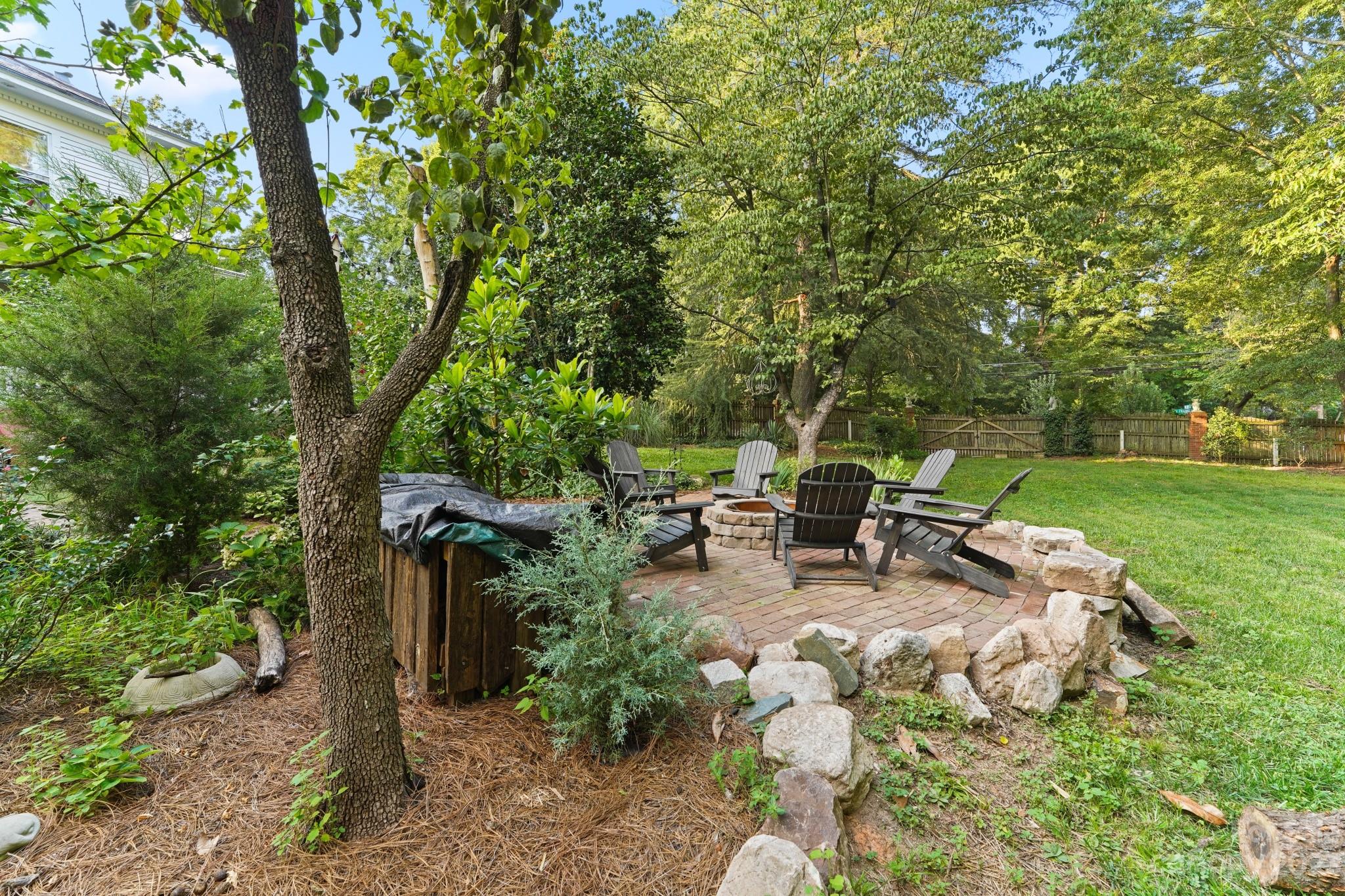 810 East Franklin Street Monroe, NC 28112 - Photo 46 of 47 a view of backyard with a table and chairs and a large tree